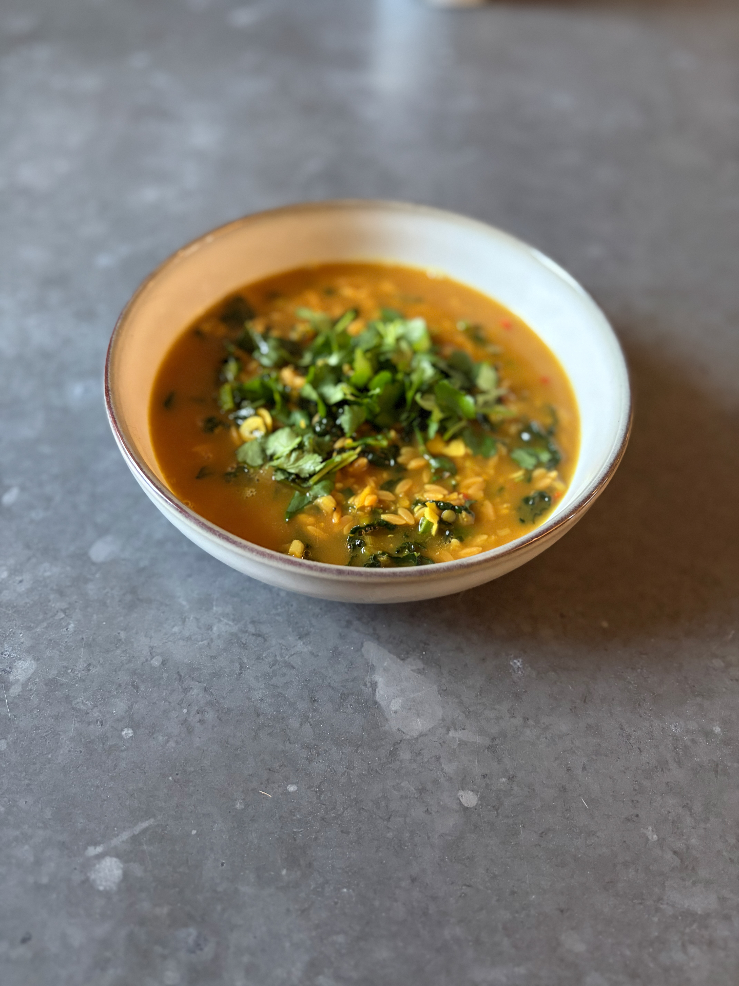 Coconut ginger soup with red lentils & greens
