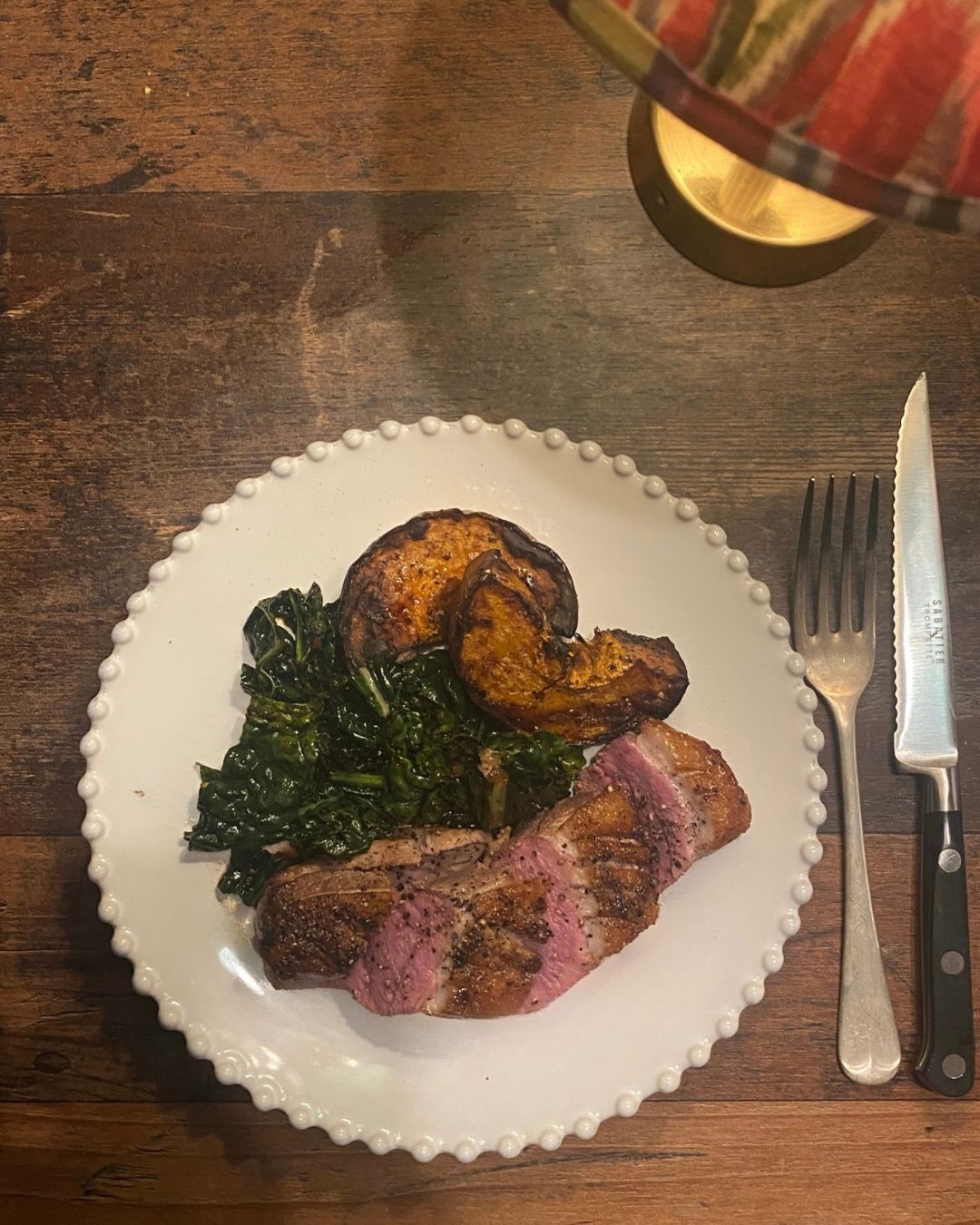 Duck with butternut squash and Asian spiced greens