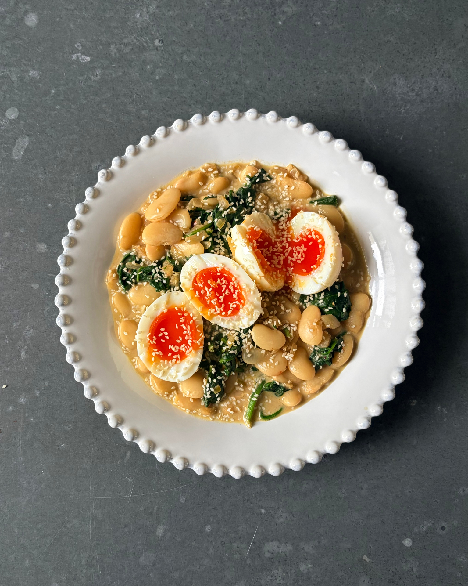 Chilli beans, greens and eggs