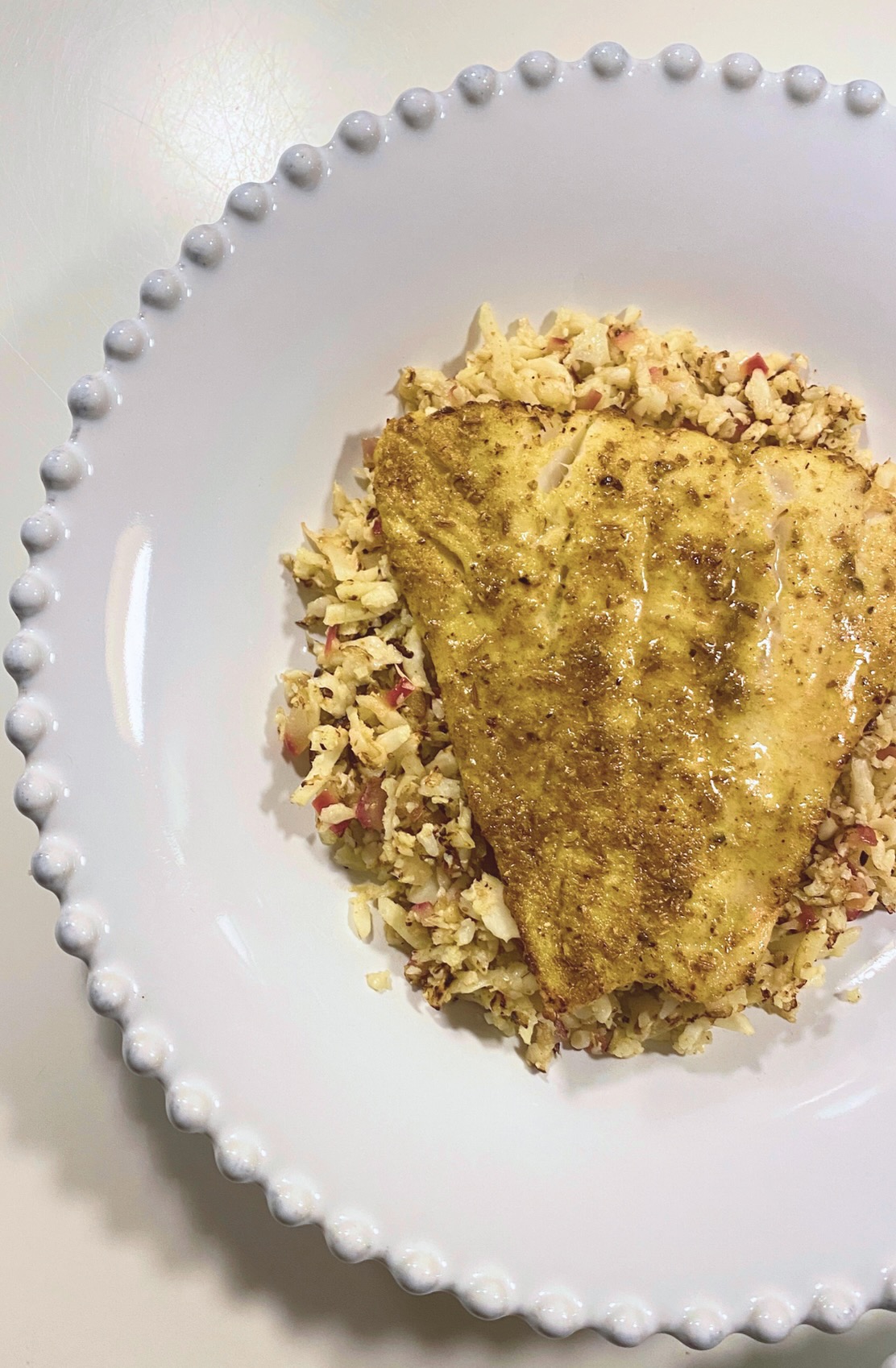 Masala baked cod with turmeric 'rice'