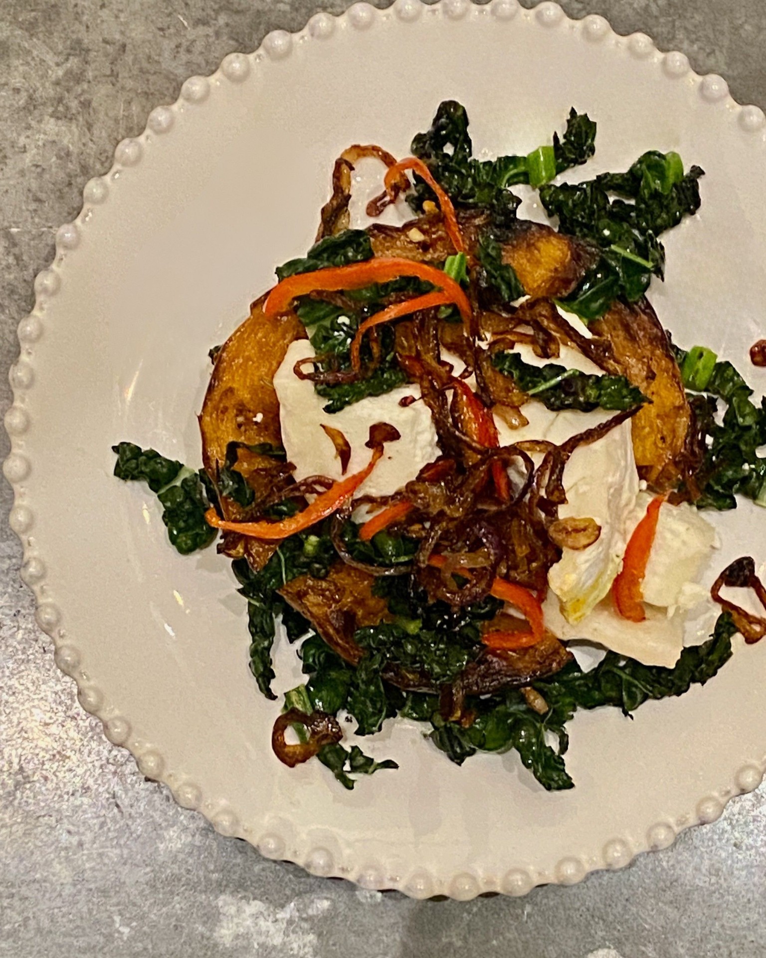 Roast squash with goat's cheese and crispy onions