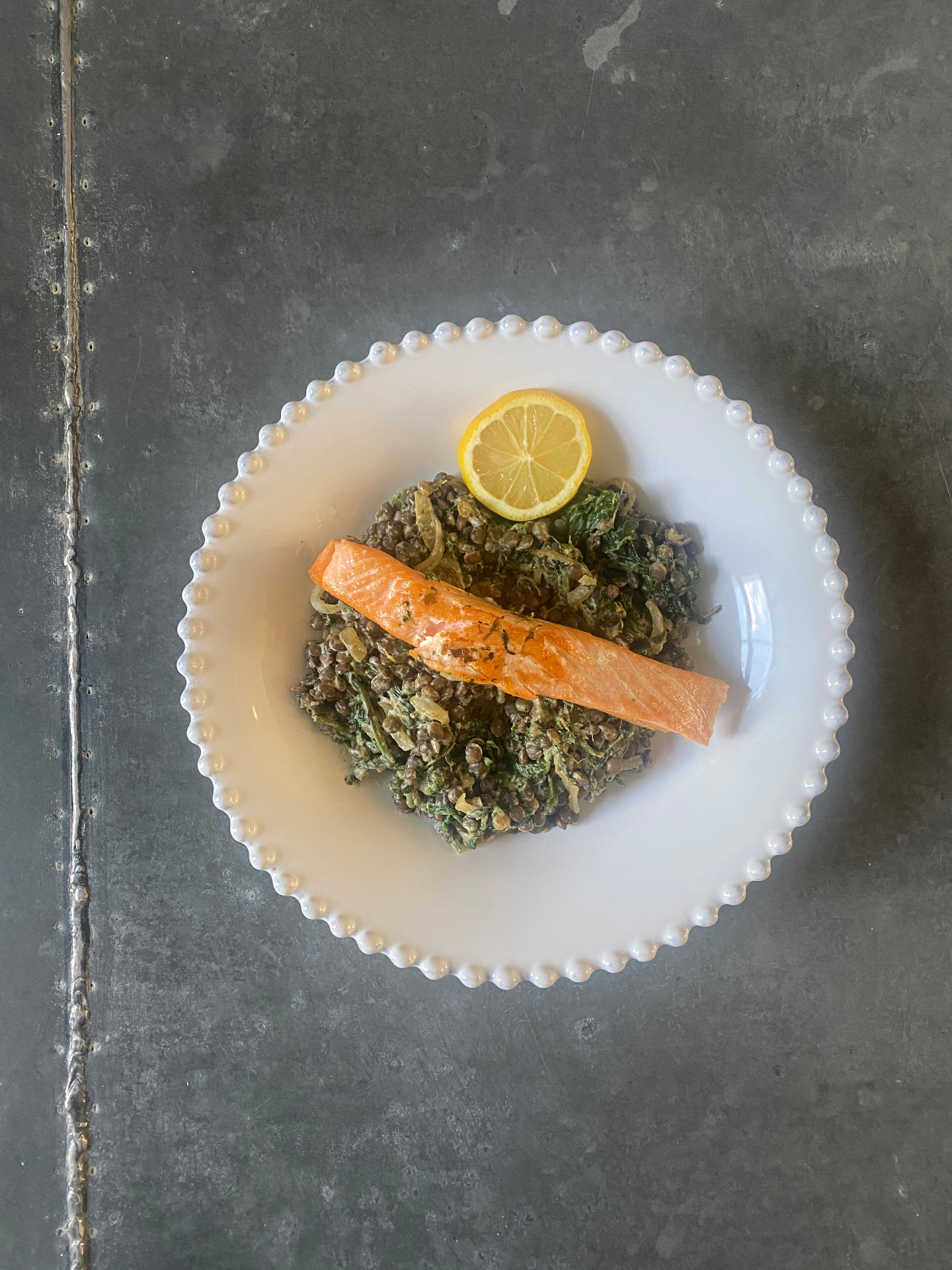 Salmon with creamy, spinach lentils