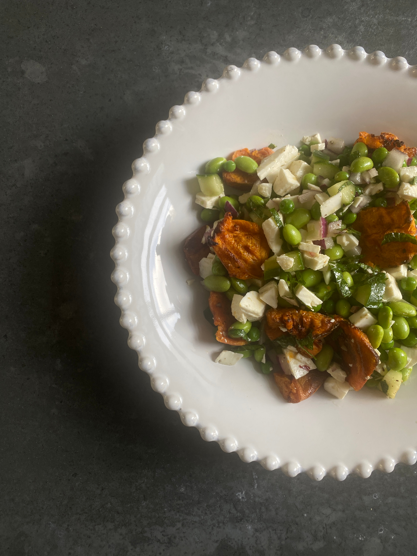 Smashed potato, pea & feta salad