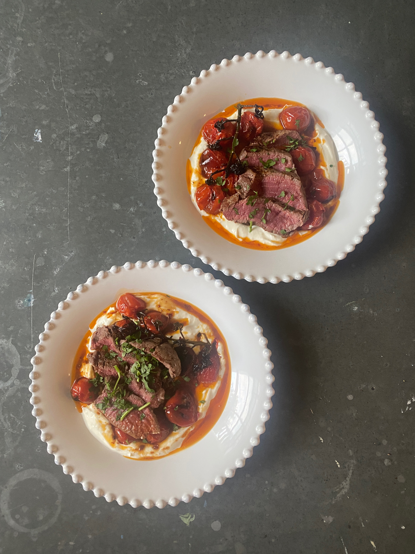 Steak with harissa tomato confit and butter bean purée